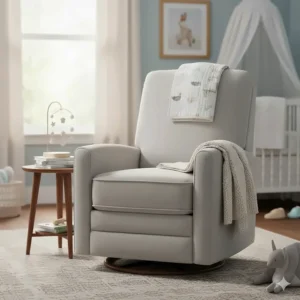 A soft grey swivel rocking recliner chair in a modern nursery setting with a cot and neutral decor.