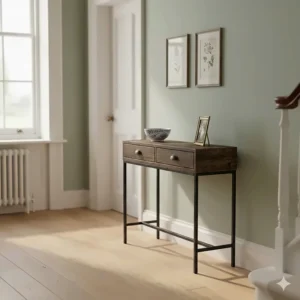 Two-drawer narrow console table with a reclaimed wood finish and black metal legs in a light hallway.