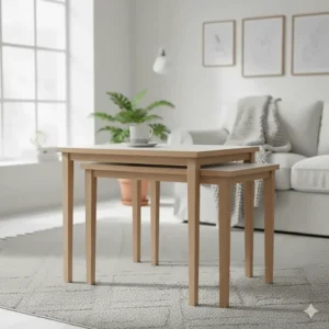 Minimalist white and beech wood nest of tables in a bright, Scandi-inspired interior.