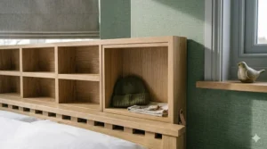 A modern white double bed frame featuring integrated storage drawers, perfect for organising a small bedroom without a wardrobe.