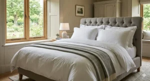 Illustration of a king size bed styled with a 13.5 tog winter duvet and four plush white pillows.