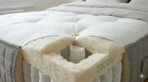 Close-up of the breathable natural wool and cotton comfort layers inside a luxury pocket sprung mattress.