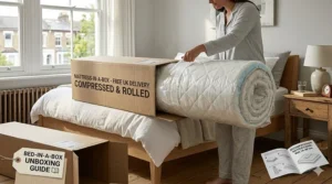 A compressed memory foam mattress being unboxed from a cardboard box in a British home hallway.