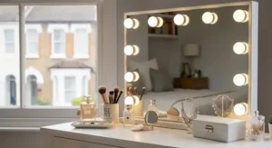 A space-saving corner dressing table with lights, designed for compact UK bedroom layouts.