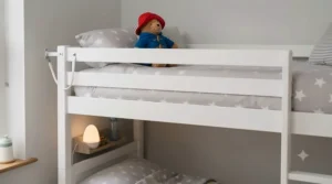 Close-up of a child-friendly, non-toxic painted finish on a robust toddler bunk bed.