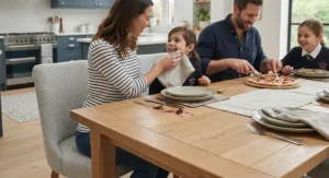 Family gathered around an easy-clean 6 seater dining table and chairs set for everyday meals.