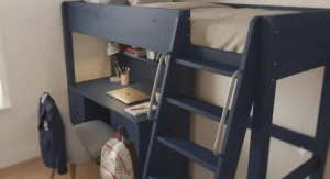 A stylish navy blue cabin bed with desk, showcasing a bold colour choice for a child's bedroom.