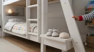 A toddler safely climbing the wide-step ladder of a secure bunk bed.