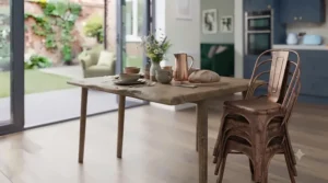 Close-up of industrial-style matte black metal dining chairs styled in a contemporary London townhouse kitchen.