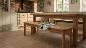 Compact oak dining bench neatly tucked underneath a small rectangular wooden kitchen table.