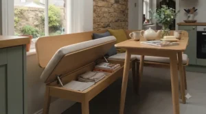 Small dining bench featuring discreet underseat storage, designed for clutter-free narrow kitchens.