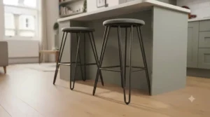 Slim metal-legged breakfast bar stools with a lightweight visual footprint ideal for narrow kitchens.