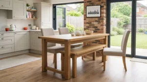 A compact kids' dining bench pushed underneath a dining table to save floor space in a kitchen.