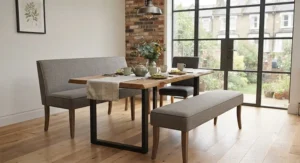 An elegant upholstered dining bench and matching chairs paired with a dark wood table for a formal dining room.
